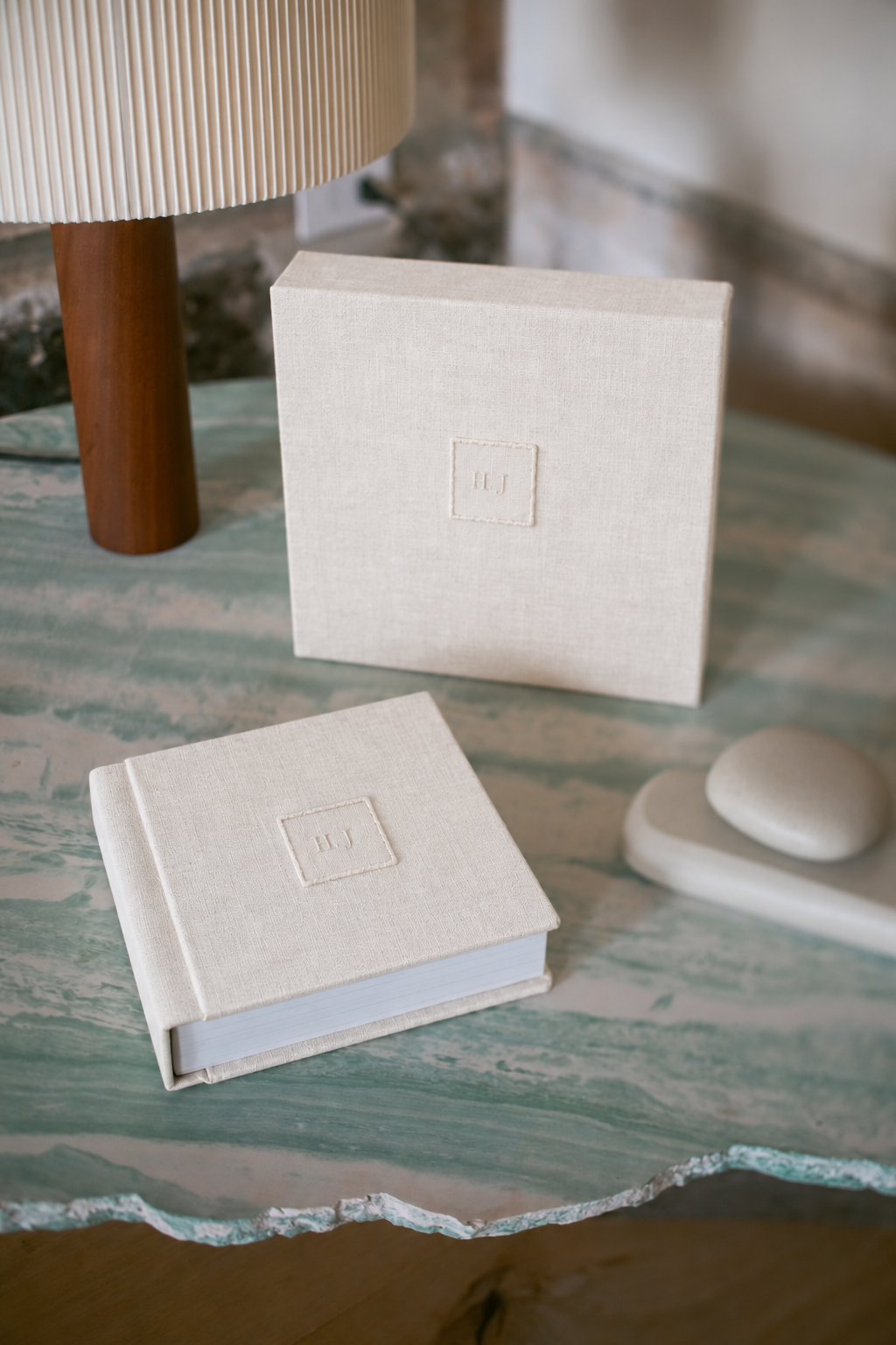 A wedding album resting beside a couture bridal veil